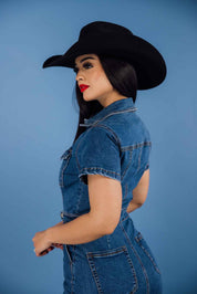 This denim collared short-sleeve button-down mini dress has a relaxed fit with a medium wash, side pockets, and chest pockets.