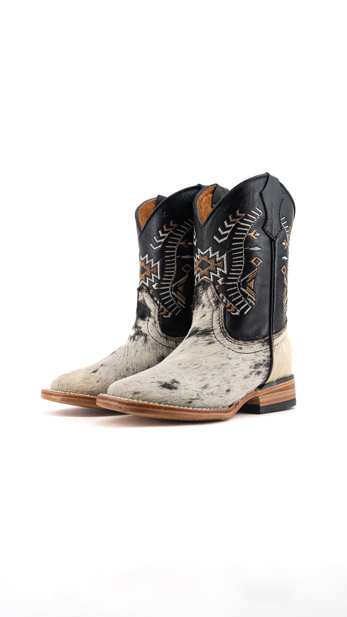 Pair of cowboy boots with intricate designs on a white background