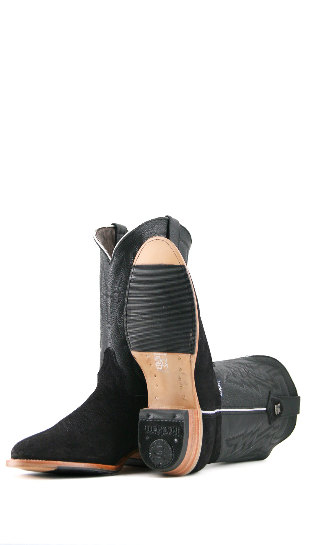 View of the Maverick boots feature a black suede vamp, black shaft, round toe, sturdy leather sole with half rubber sole, and rubber heel.