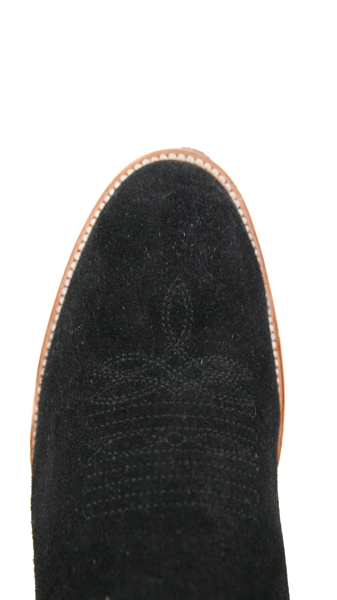 Top-down close-up of black Maverick Roughout cowboy boot vamp, showcasing the black suede print detail, stitching and round toe.