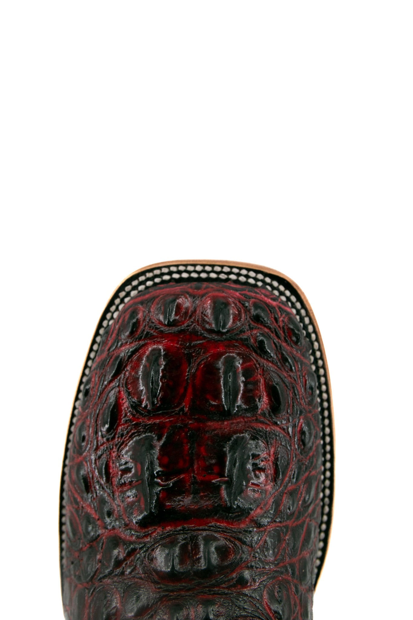 Top-down close-up of the black cherry Caiman Tail Hornback cowboy boot vamp showing the caiman print detail and square toe.