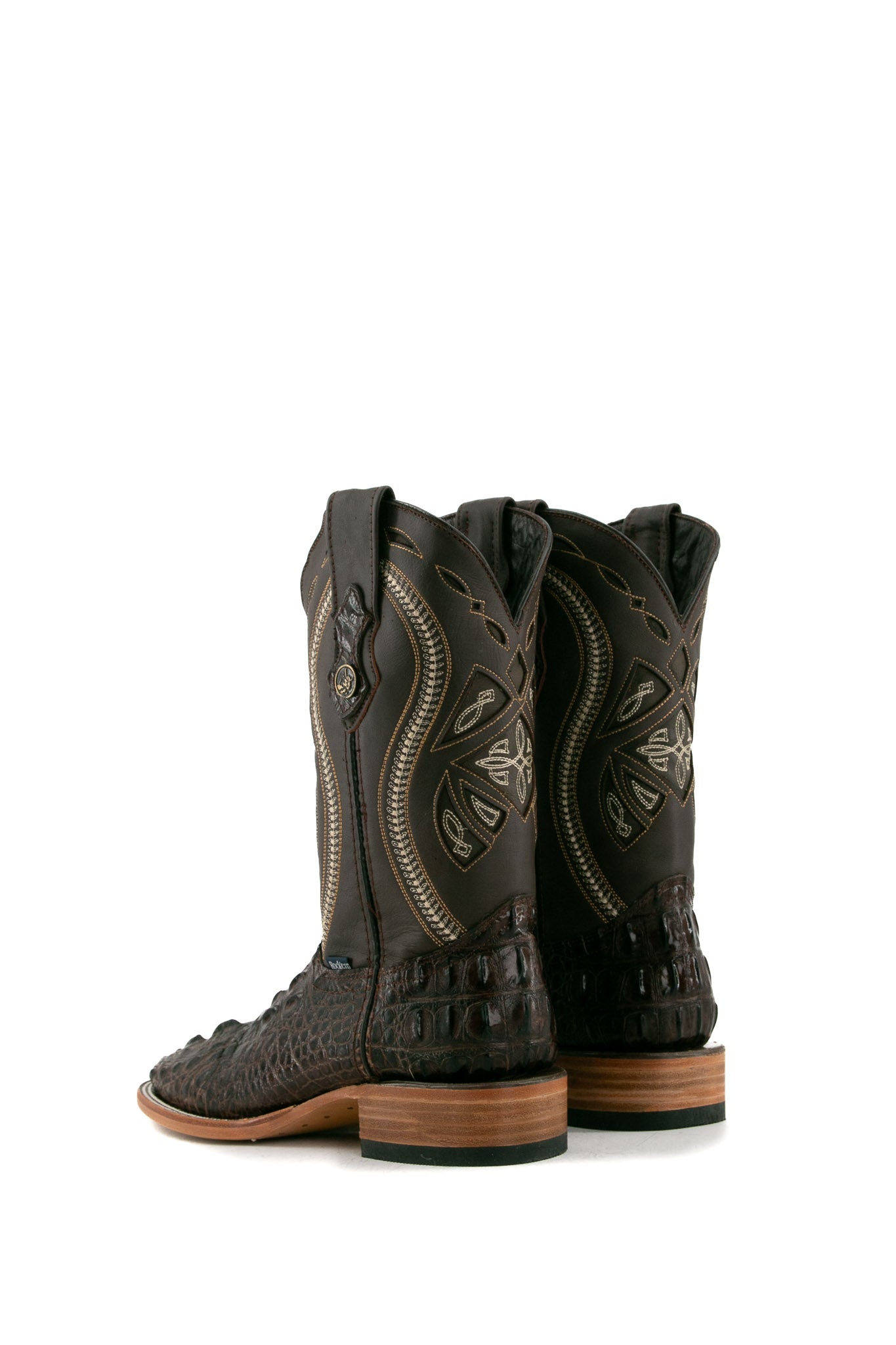 Back view of the brown Caiman Tail Hornback cowboy boots are genuine leather, featuring a square toe, inlays in the brown shaft and a natural-tone sole.