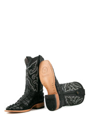 View of the black Caiman Tail cowboy boots are genuine leather, featuring a square toe, black caiman print vamp, black embroidery shaft, tan leather sole and rubber heel.
