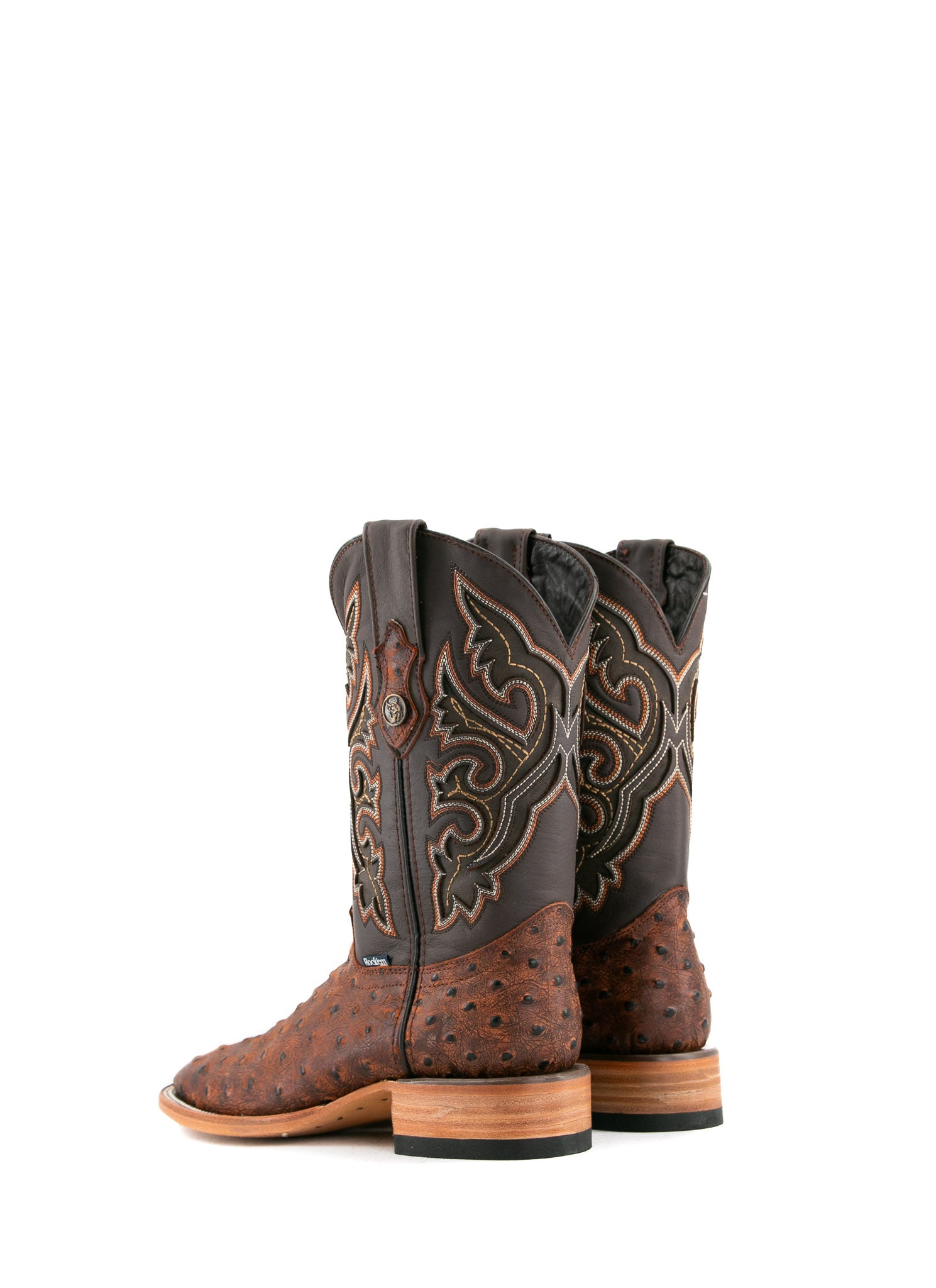 Back view of the Ostrich Matte Rustic boots in Rustic Shedron with a square toe, ostrich quill texture, brown leather shaft with brown embroidery, and stacked heel