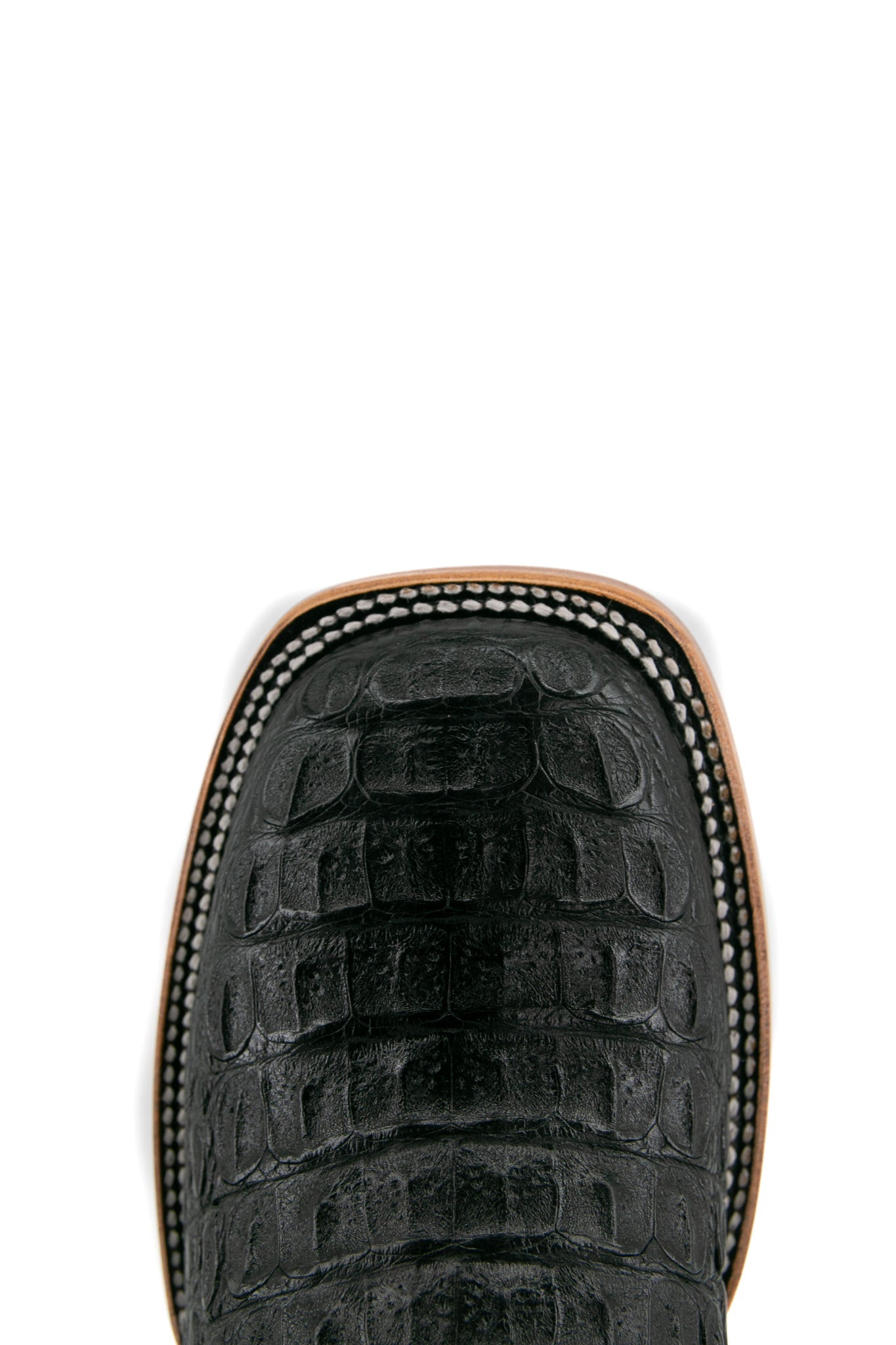 Top-down close-up of black Cody Caiman cowboy boot vamp, showcasing the black and caiman print detail and square toe.