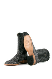 View of black safari Giant Caiman Hornback cowboy boots in genuine leather, featuring a square toe, black and white caiman print vamp, black shaft with white embroidery, tan leather sole, and rubber heel.