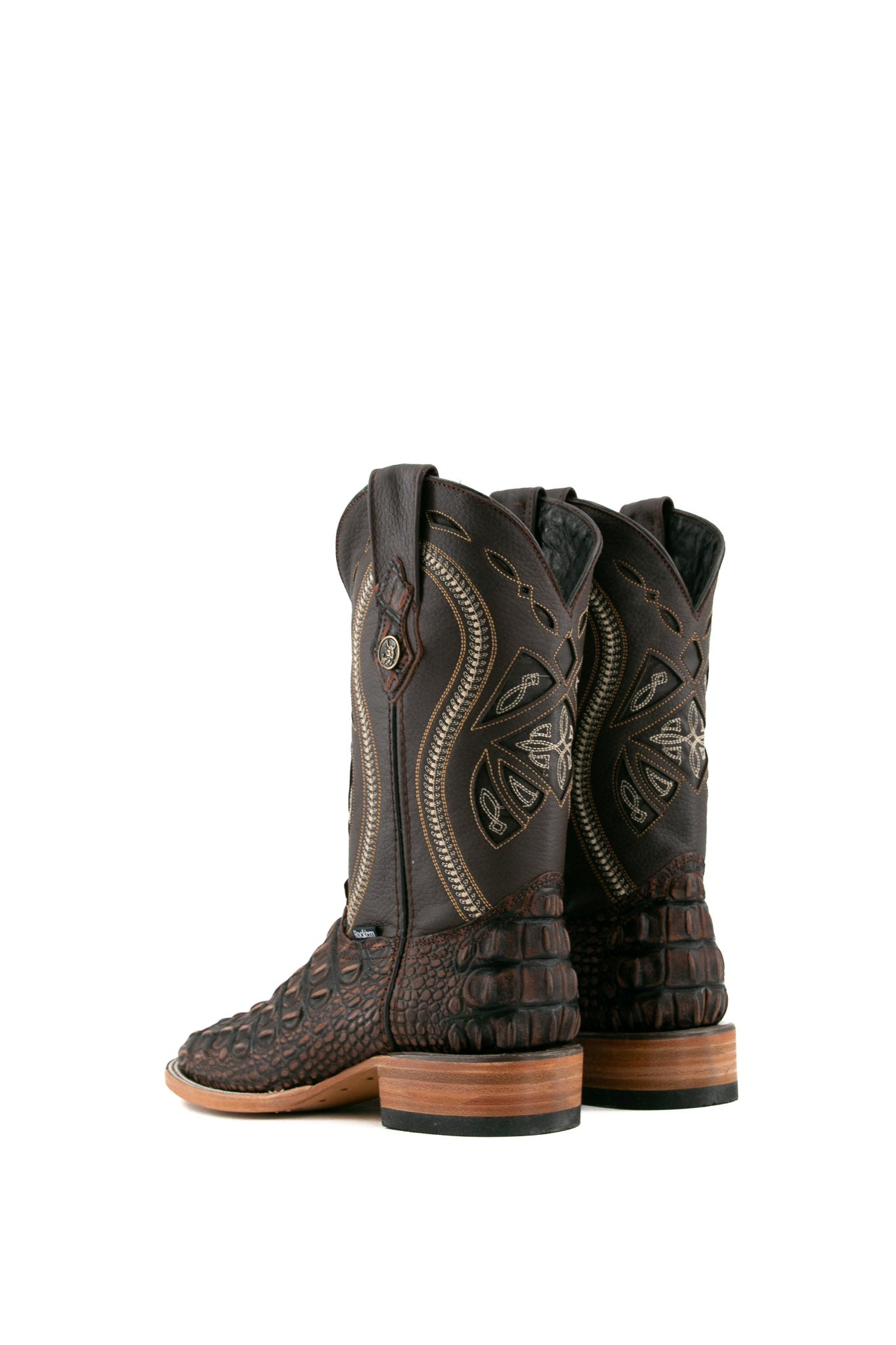 Back view of rustic brown Giant Caiman Hornback cowboy boots in genuine leather, featuring a square toe, brown caiman print vamp, brown shaft with white embroidery, and rubber heel.