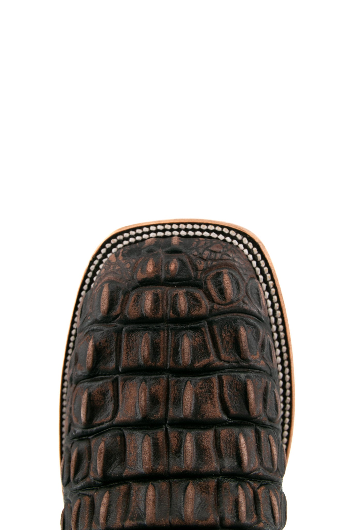 Top-down close-up of rustic brown Giant Caiman Hornback cowboy boot vamp, highlighting the brown and black caiman print detail and square toe.