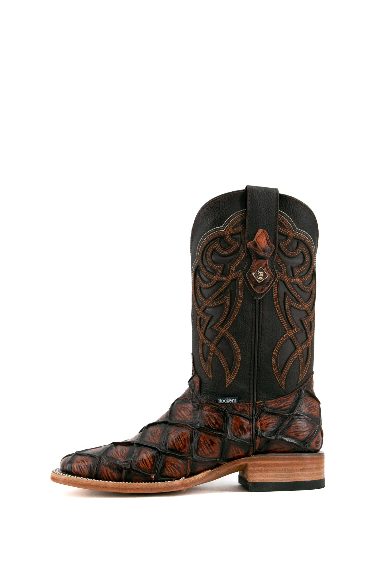 Side view of shedron Big Bass Pirarucu Cowboy Boot features genuine leather, square toe, shedron pirarucu print vamp, brown embroidered shaft, rubber heel, and tan sole.