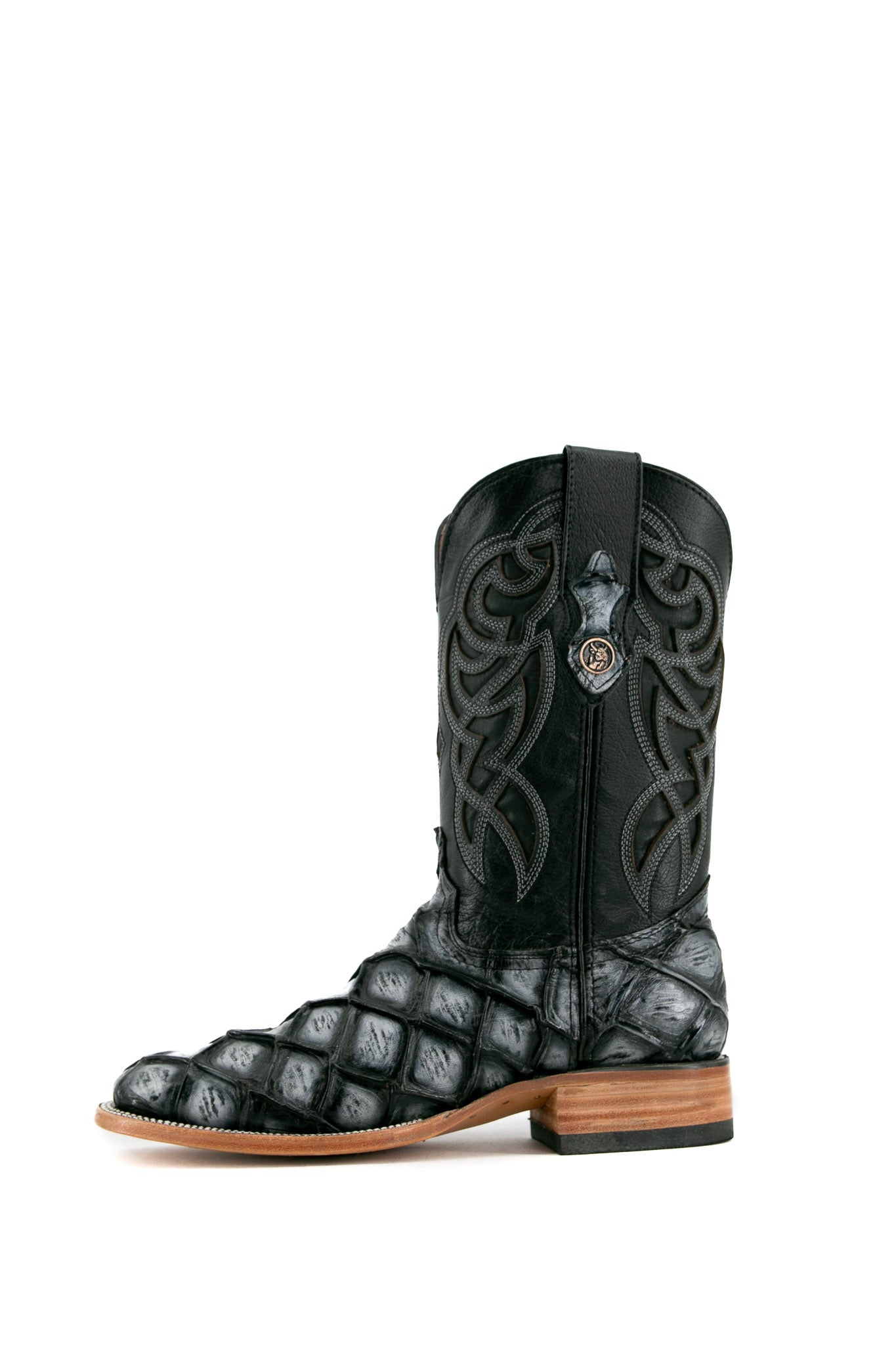 Side view of black safari Big Bass Pirarucu Cowboy Boot features genuine leather, square toe, black and gray pirarucu print vamp, black embroidered shaft, rubber heel, and tan sole.