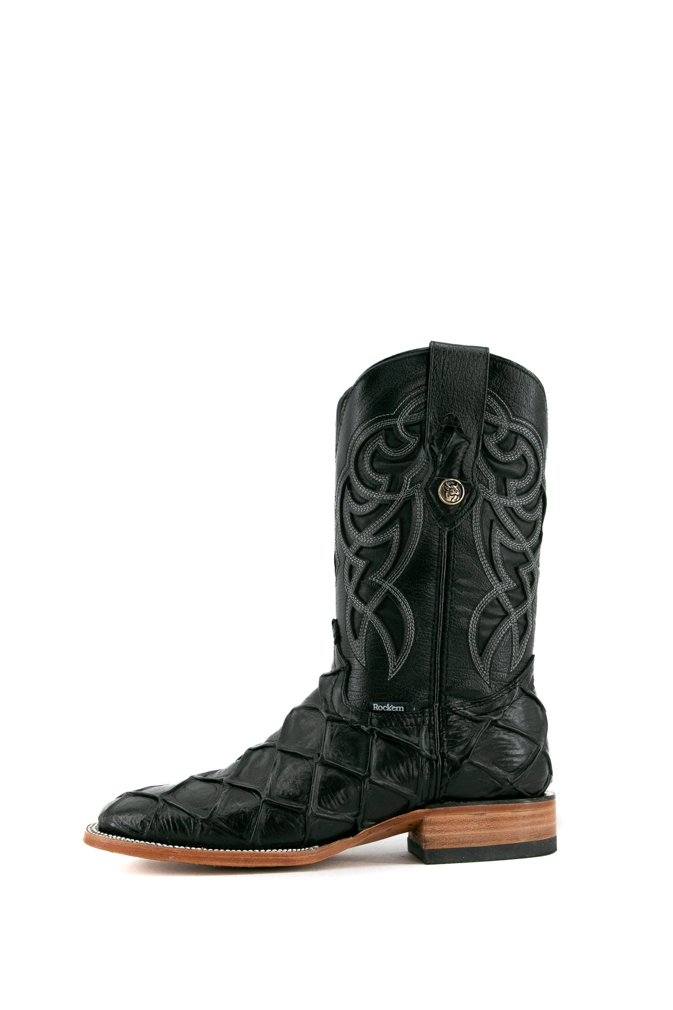 Side view of black Big Bass Pirarucu Cowboy Boot features genuine leather, square toe, black pirarucu print vamp, black embroidered shaft, rubber heel, and tan sole.