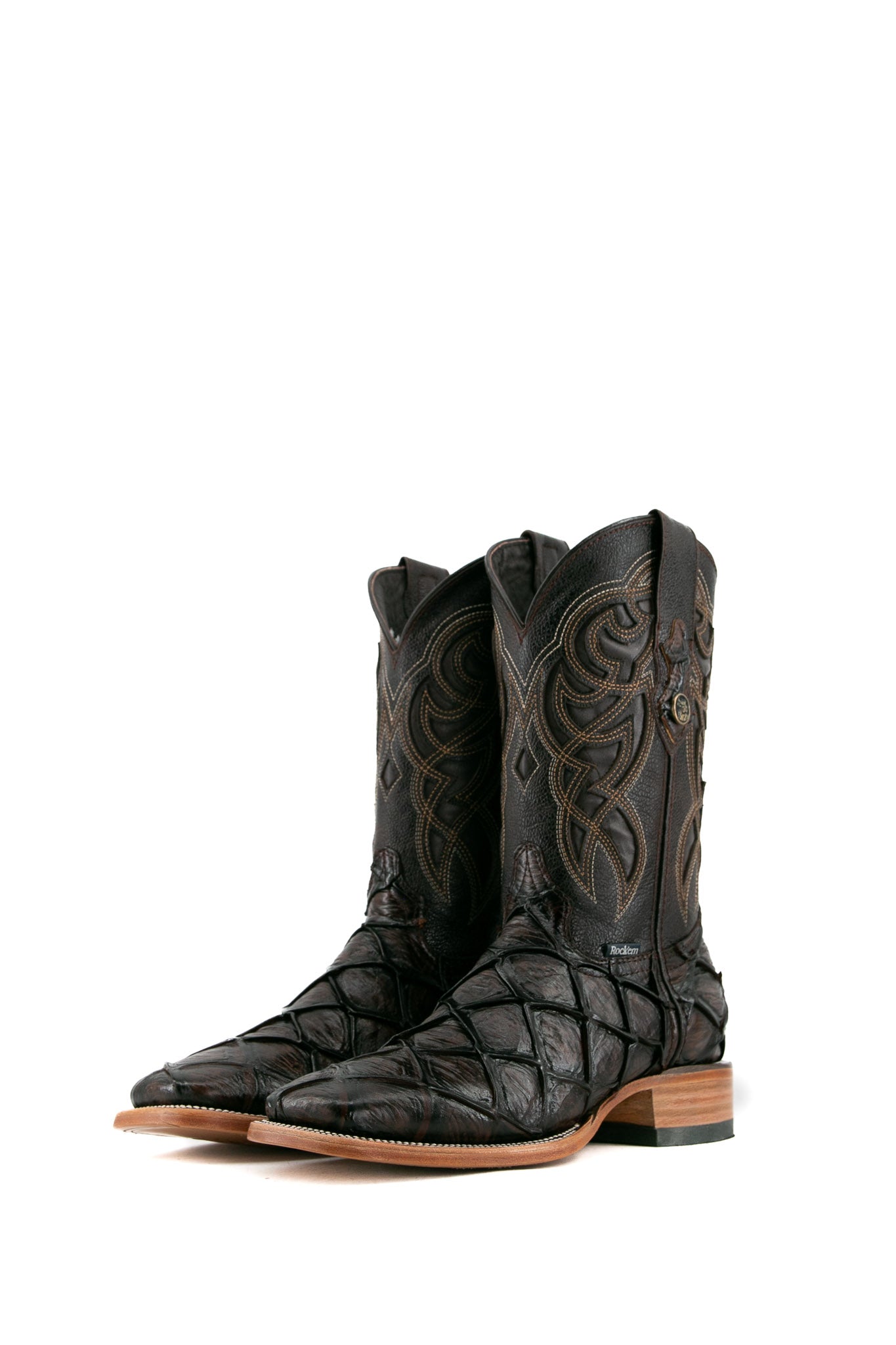 The brown shedron Big Bass Pirarucu Cowboy Boot in genuine leather, square toe, brown pirarucu print vamp, brown embroidered shaft, rubber heel, and tan sole.