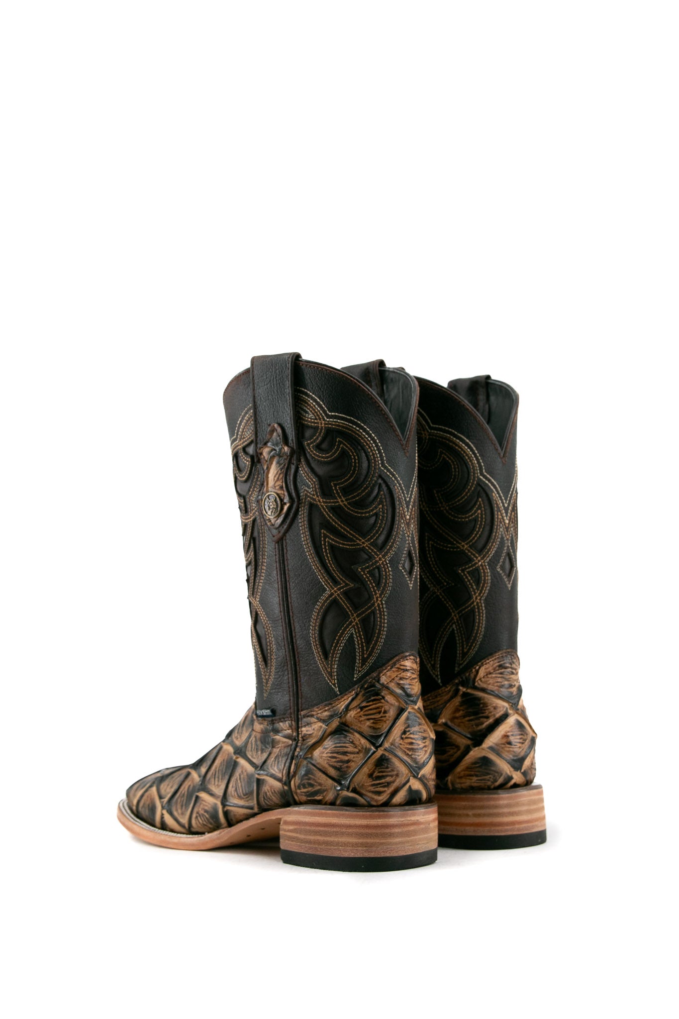 Back view of the camel Big Bass Pirarucu Cowboy Boot in genuine leather, square toe, camel pirarucu print vamp, brown embroidered shaft, rubber heel, and tan sole.