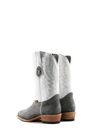 Back view of the Maverick boots feature a grey suede vamp, white shaft, square toe, sturdy leather sole, and rubber heel.
