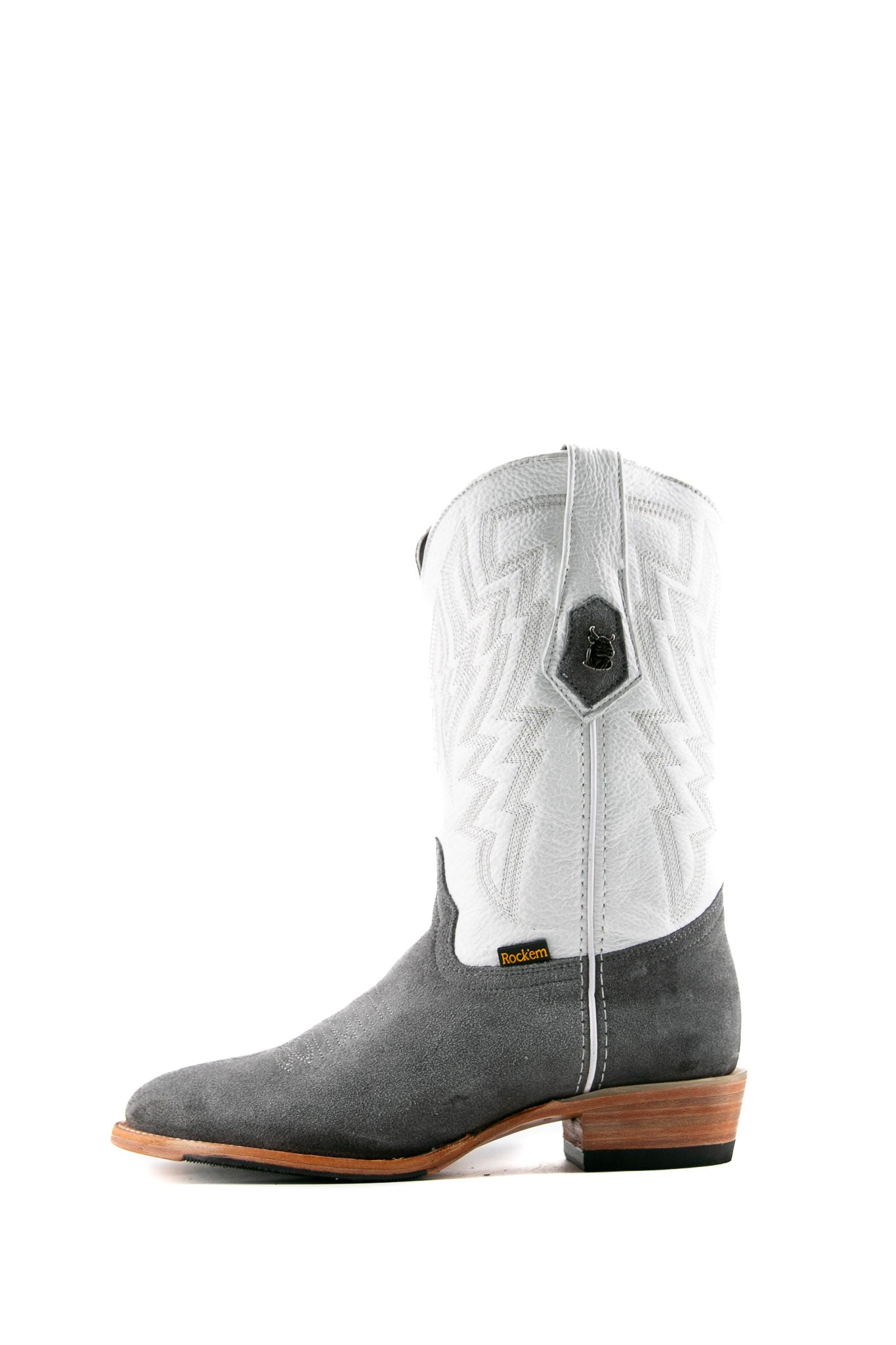 Side view of the Maverick boots feature a grey suede vamp, white shaft, round toe, sturdy leather sole, and rubber heel.