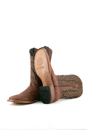 View of sand Rock'em Elephant cowboy boots in genuine leather, featuring a square toe, elephant print vamp, embroidered shaft, rubber heel, and tan leather sole.