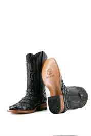 View of the Black Fish Navy Pirarucu cowboy boots are genuine leather, featuring a square toe, navy pirarucu print vamp, black shaft with patchwork design with star-shaped perforations, rubber heel.