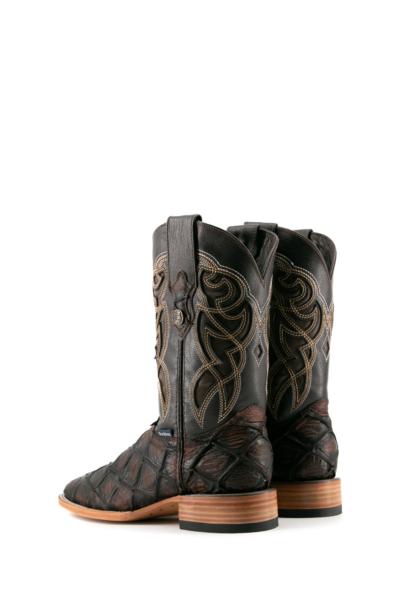 Back view of the brown Big Bass Pirarucu Matte cowboy boots in genuine leather, featuring a square toe, brown pirarucu print vamp, brown shaft with brown embroidery, rubber heel.