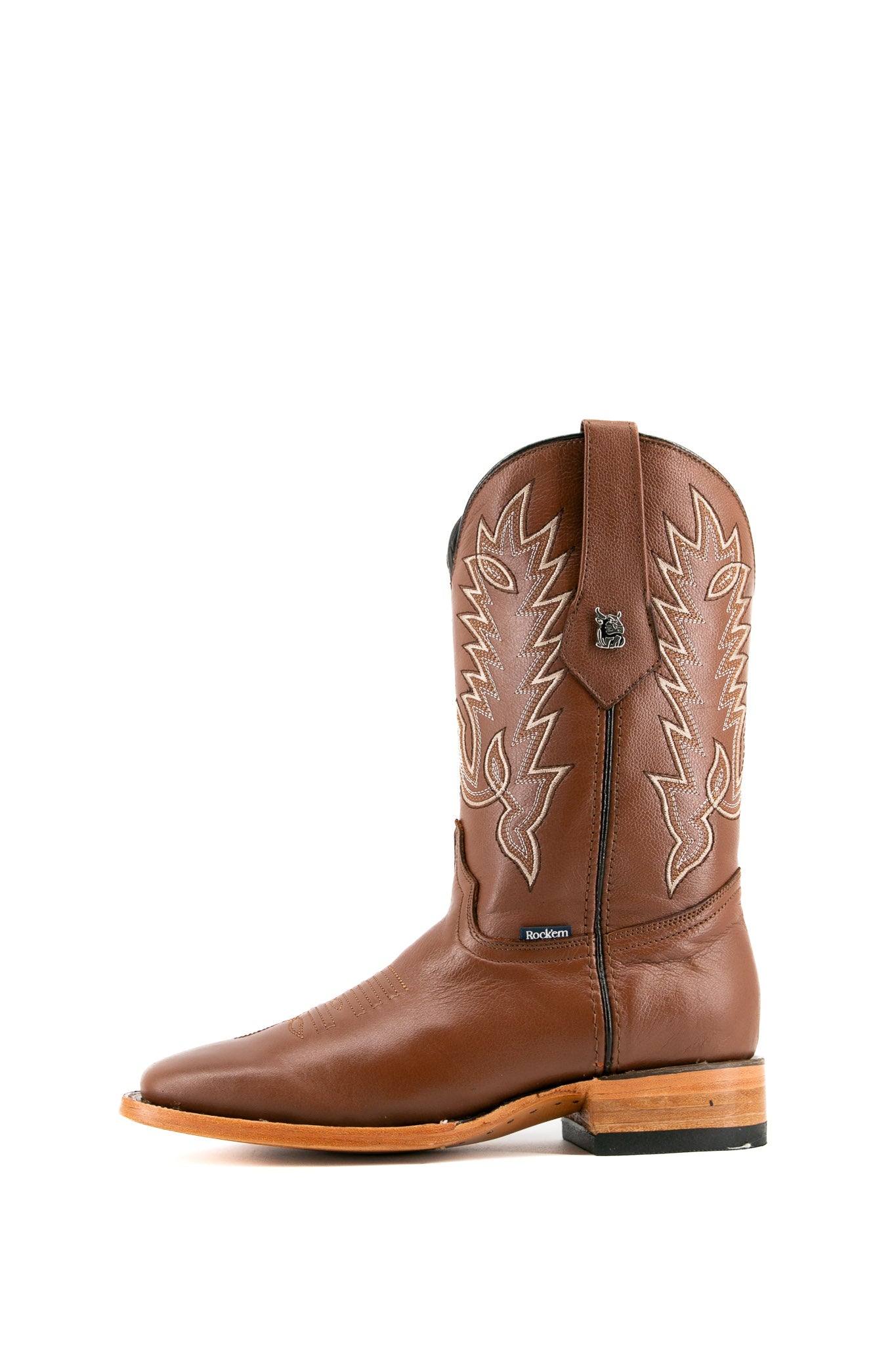 The Heritage Rainbow cowboy boots feature honey leather with intricate stitching and embroidery, a Rock'em bull emblem, durable leather sole, and rubber heel.