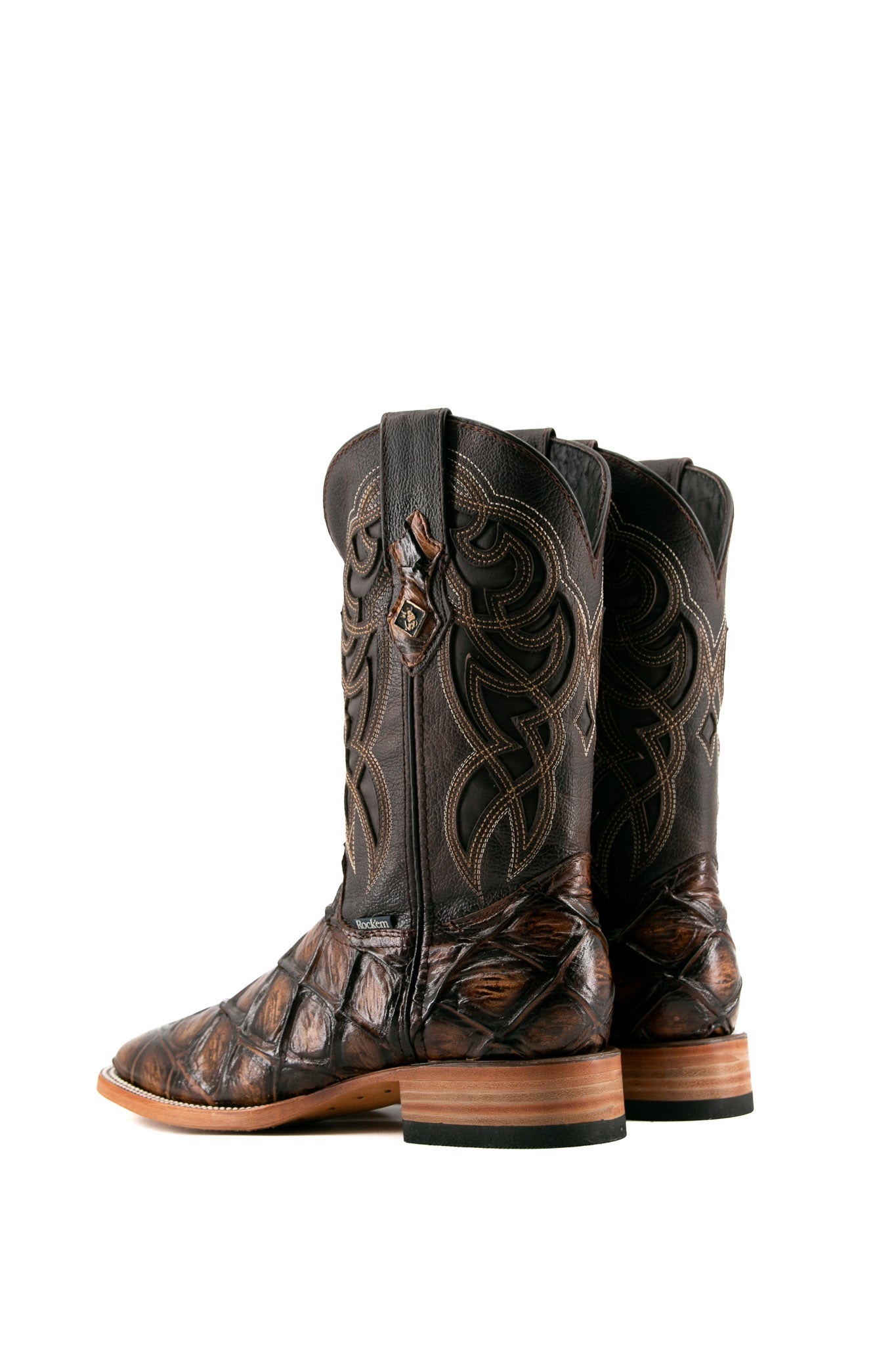Back view of Honey Big Bass Pirarucu Cowboy Boot in genuine leather, square toe, honey pirarucu print vamp, brown embroidered shaft, rubber heel, and tan sole.