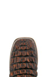Top-down close-up of rustic shedron Giant Caiman Hornback cowboy boot vamp, showcasing the shedron and black caiman print detail and square toe.