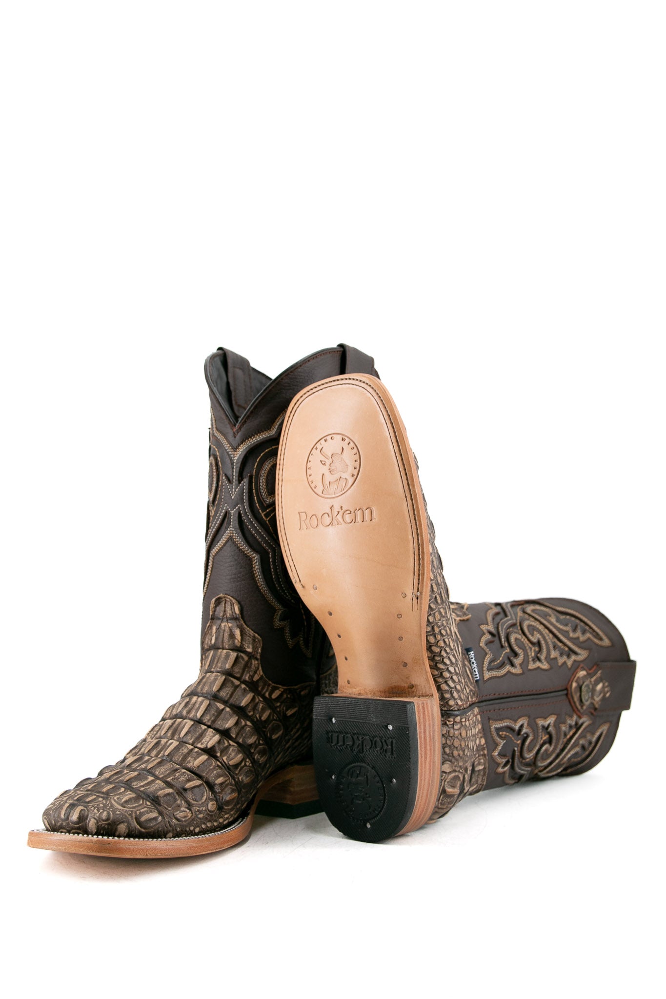 View of rustic bone Giant Caiman Hornback cowboy boots in genuine leather, featuring a square toe, cream and brown caiman print vamp, brown embroidered shaft, tan leather sole and rubber heel.