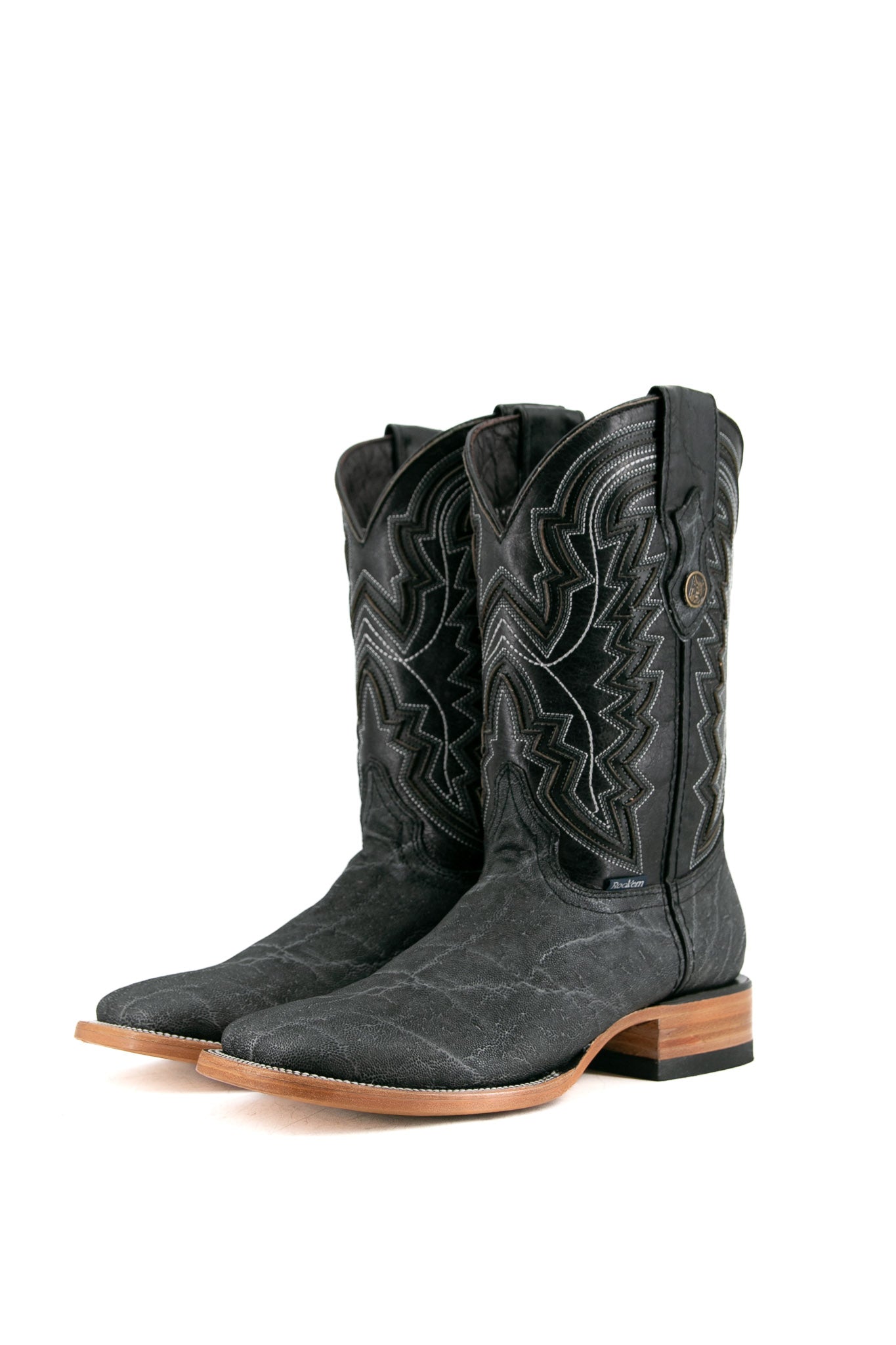 The old silver Rock'em Elephant cowboy boots are crafted from genuine leather, featuring a square toe, Elephant print vamp, embroidered shaft, and rubber heel.