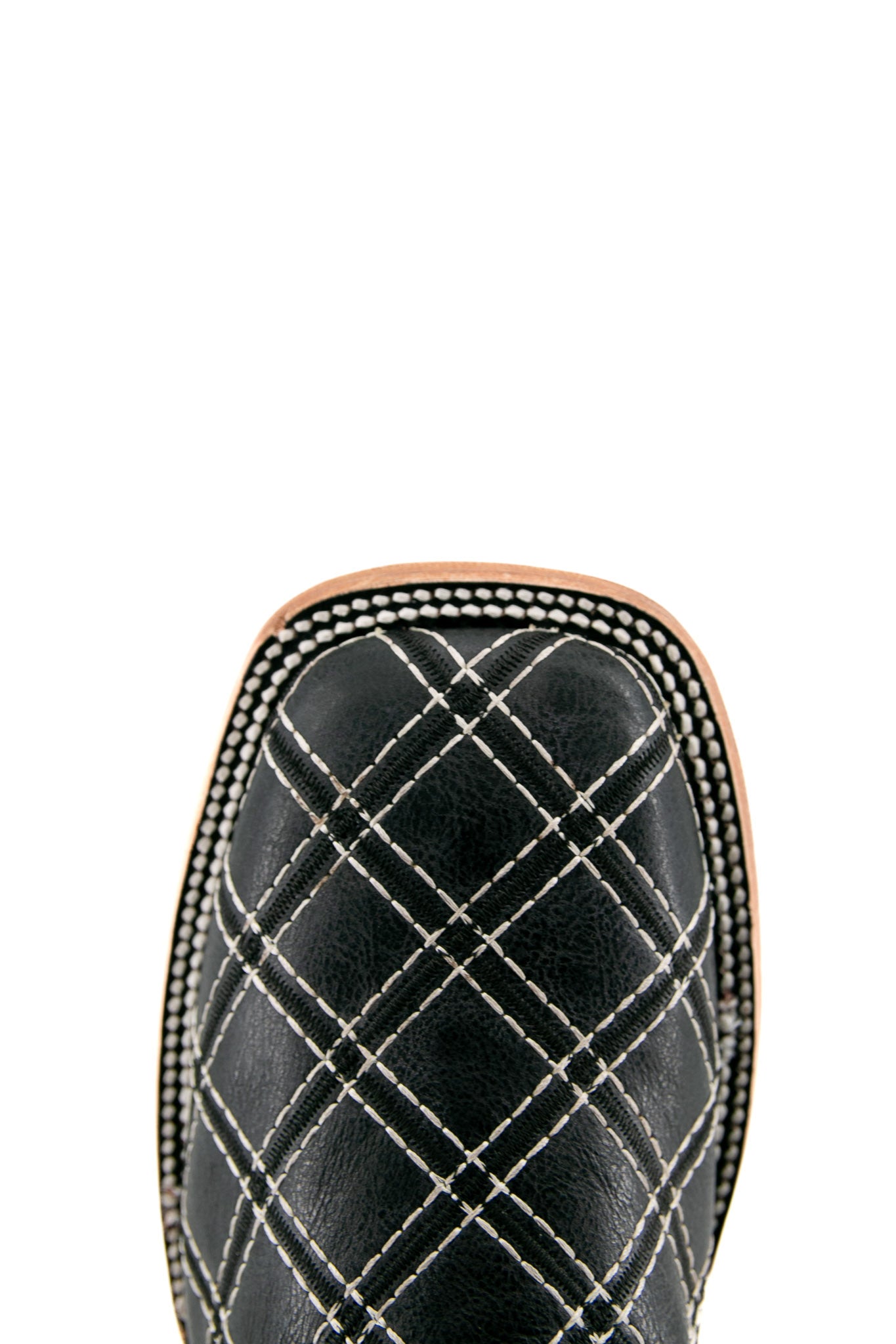 Top-down close-up of negro Roca Patchwork cowboy boot vamp, showcasing the black pirarucu print detail, double stitching and square toe.