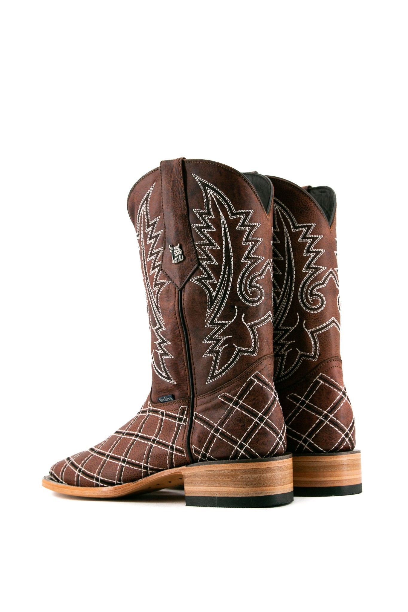 Back view of shedron Roca Patchwork Cowboy Boot in genuine leather, square toe, shedron roca patchwork print vamp, shedron embroidered shaft, rubber heel, and tan sole.