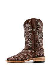 Side view of shedron Roca Patchwork Cowboy Boot in genuine leather, square toe, shedron roca patchwork print vamp, shedron embroidered shaft, rubber heel, and tan sole.