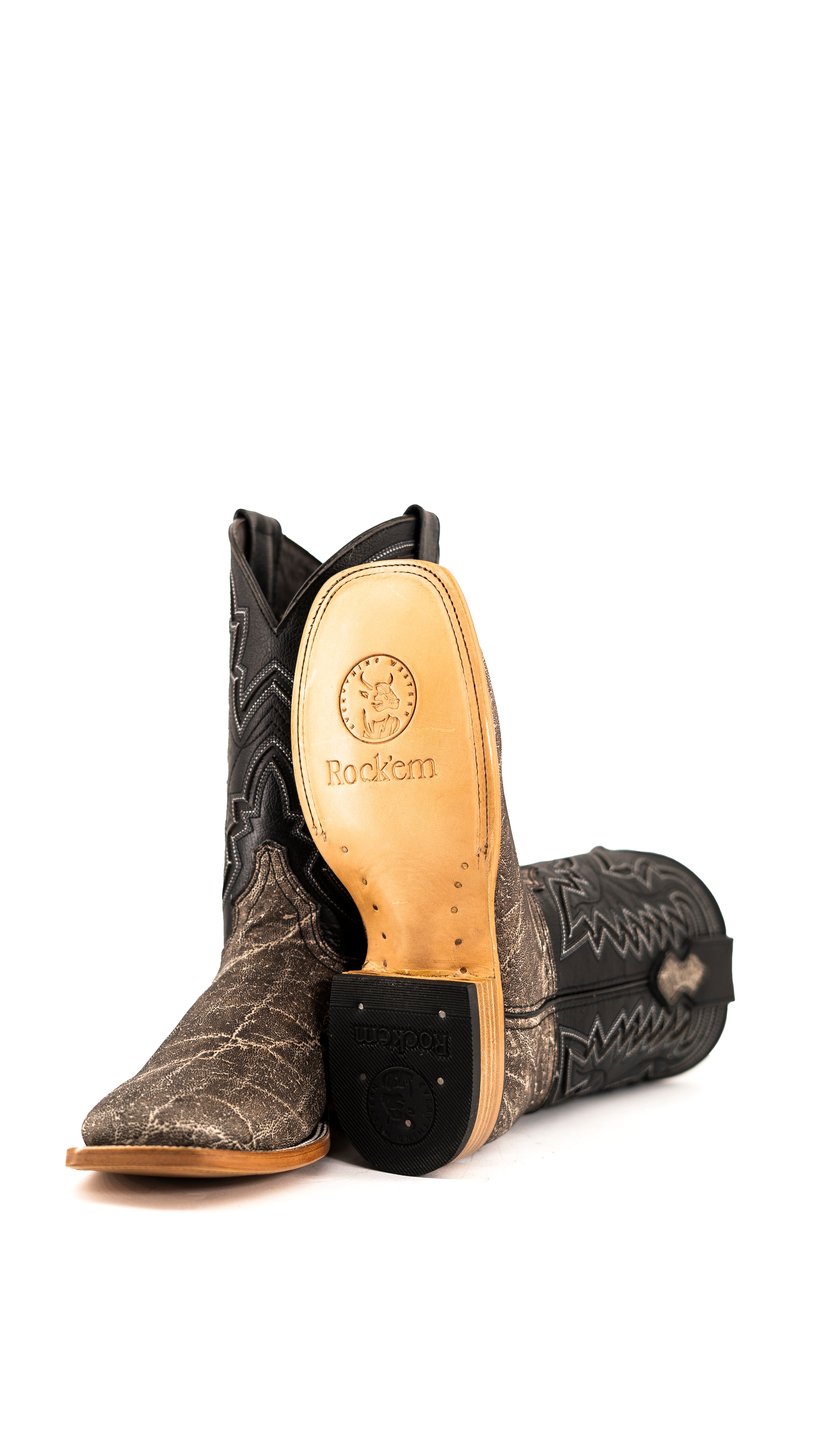 View of slate gray Rock'em Elephant cowboy boots in genuine leather, featuring a square toe, elephant print vamp, embroidered shaft, rubber heel, and tan leather sole.