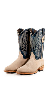 The Maverick boots feature a sand suede vamp, blue shaft, round toe, sturdy leather sole, and rubber heel.