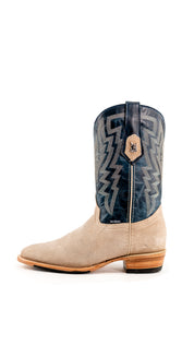 Side view of the Maverick boots feature a sand suede vamp, blue shaft, round toe, sturdy leather sole, and rubber heel.