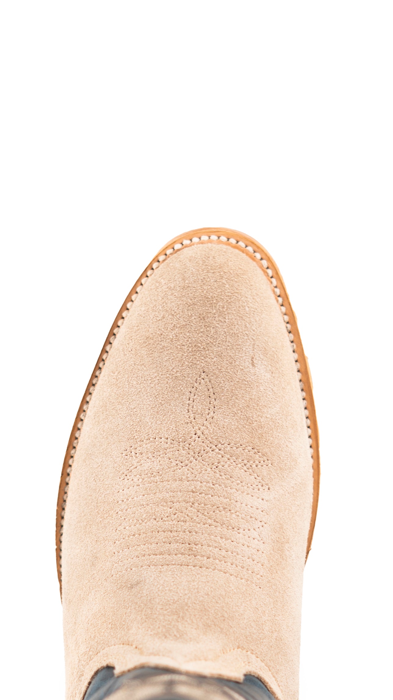 Top-down close-up of sand Maverick Roughout cowboy boot vamp, showcasing the sand suede print detail, stitching and round toe.