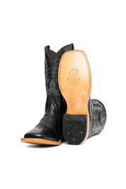 The Heritage Rainbow cowboy boots feature black leather with intricate stitching and embroidery, a Rock'em bull emblem, durable leather sole, and rubber heel.