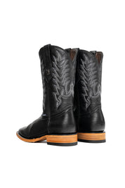 The Heritage Rainbow cowboy boots feature black leather with intricate stitching and embroidery, a Rock'em bull emblem, durable leather sole, and rubber heel.
