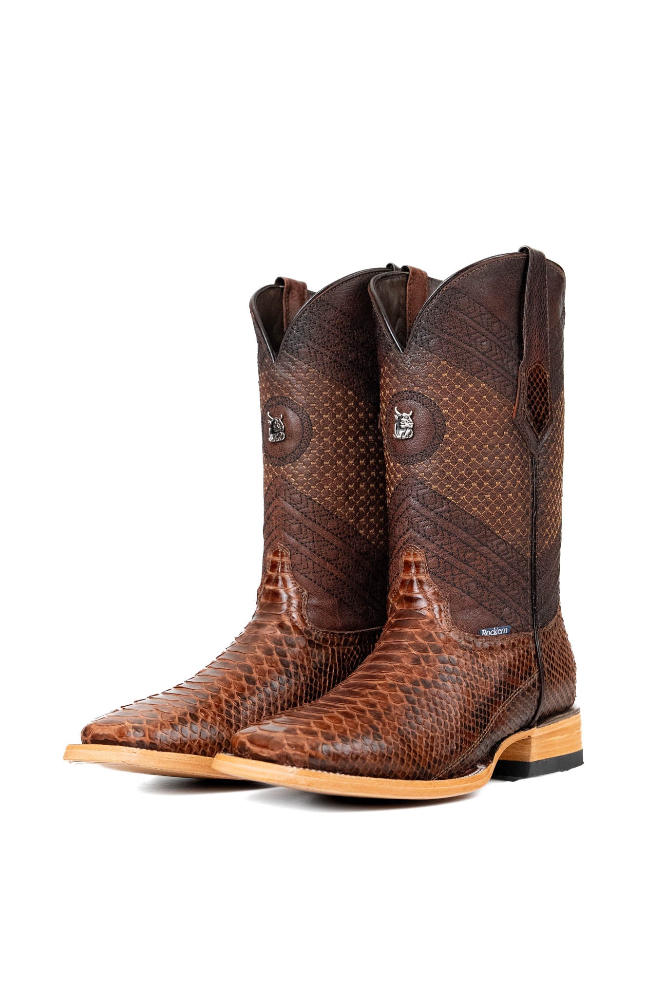 The Andersen Python Exotic cowboy boots are genuine leather, featuring a square toe, brown python print vamp, brown shaft with tan embroidery, rubber heel, and a leather sole.