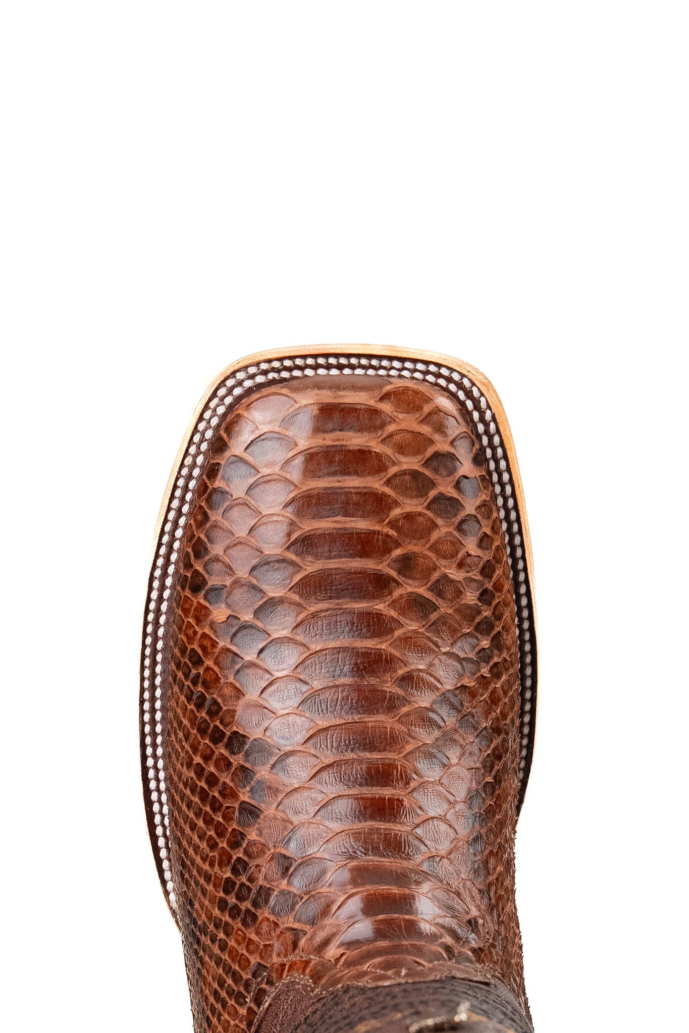 Top-down close-up of Andersen python exotic cowboy boot vamp, showcasing the brown python print scale, double stitching and square toe.