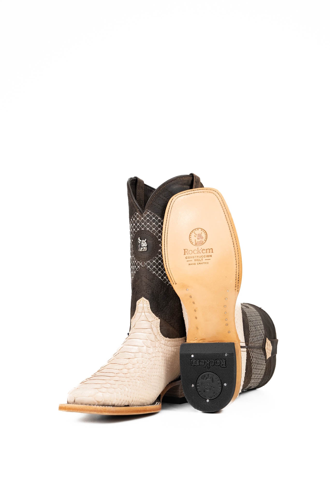 View of the Andersen Python Exotic cowboy boots are genuine leather, featuring a square toe, python print vamp, brown shaft with white embroidery, rubber heel, and a leather sole.