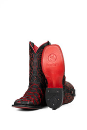View of the Bruce Jumbo Fish boot features a red and black Pirarucu fish print vamp, a black leather shaft with red embroidery, a square toe, and red sole.