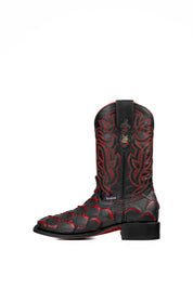 Side view of the Bruce Jumbo Fish boot features a red and black Pirarucu fish print vamp, a black leather shaft with red embroidery, a square toe, and black sole.