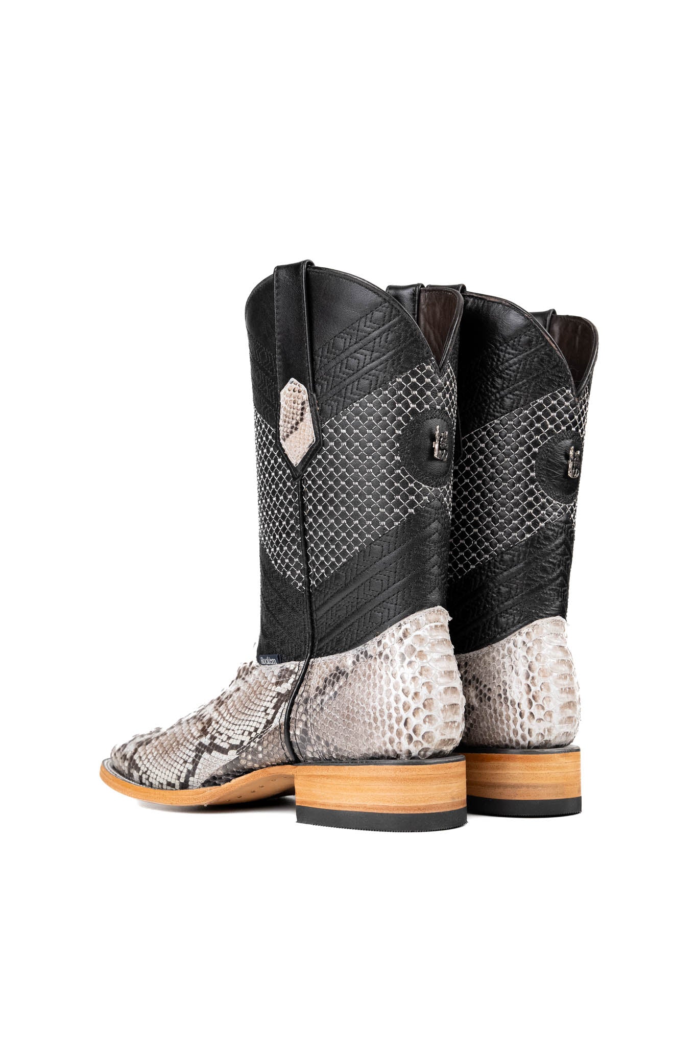 Back view of the Andersen Python Exotic cowboy boots are genuine leather, featuring a square toe, white python print vamp, black shaft with tan embroidery, rubber heel, and a leather sole.