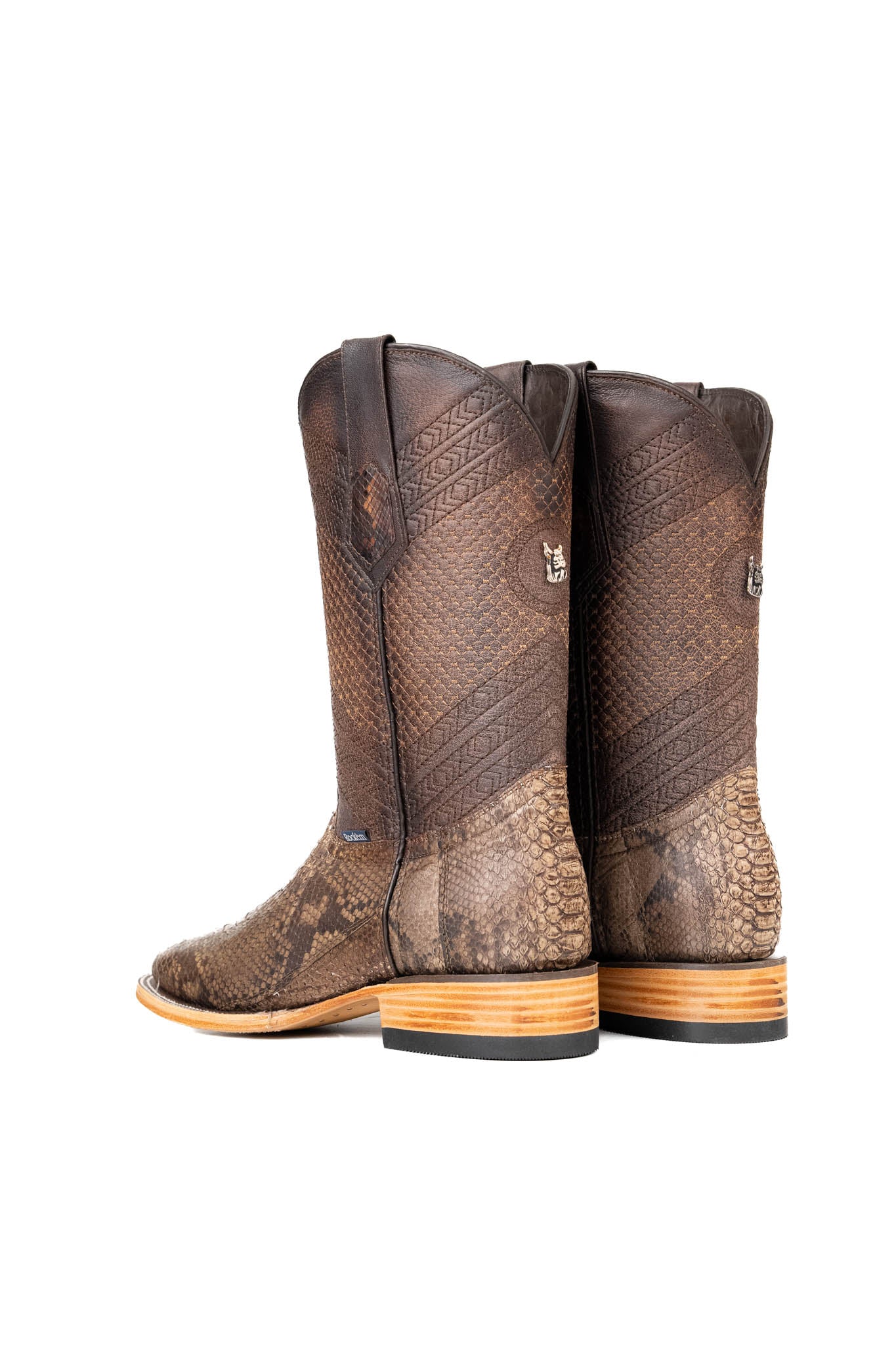 Back view of the Andersen Python Exotic cowboy boots are genuine leather, featuring a square toe, tan python print vamp, brown shaft with tan embroidery, rubber heel, and a leather sole.