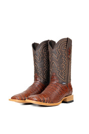 Side view of the Bruce Belly Caiman Cowboy Boots in cognac are made of genuine leather with a round toe, a cognac color belly caiman print vamp, brown embroidered shaft, and leather sole.