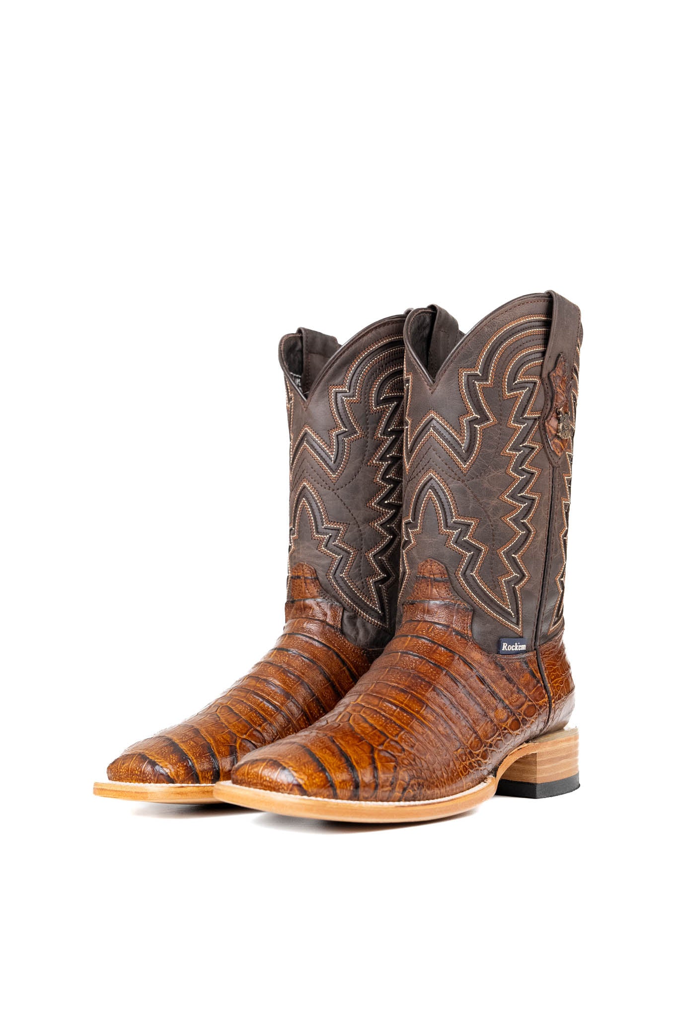 The Bruce Belly Caiman Cowboy Boots in honey are made of genuine leather with a round toe, a honey color belly caiman print vamp, brown embroidered shaft, and leather sole.