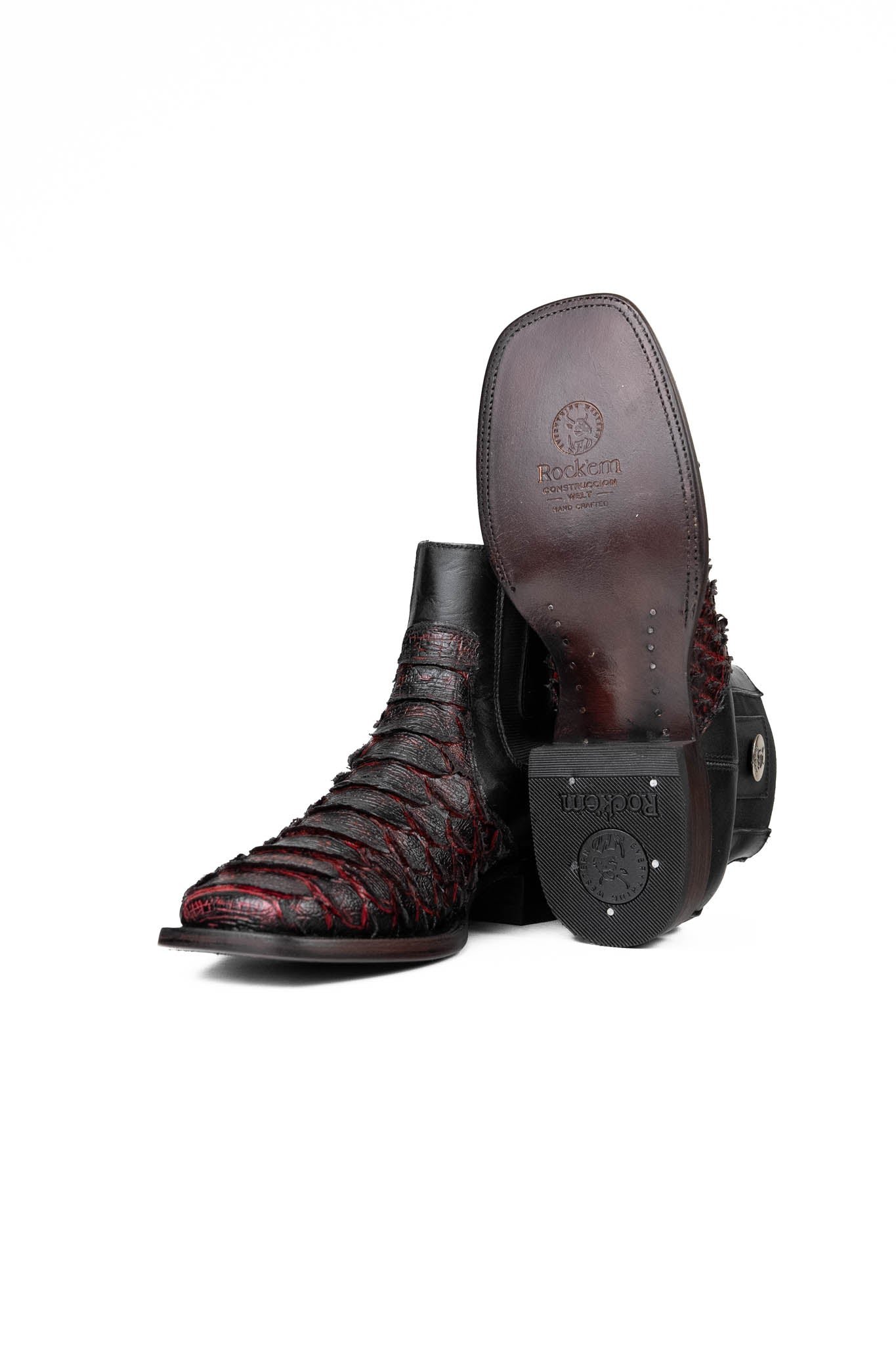 View of the Rock'em clan python boots in blackcherry are genuine leather. Featuring a square toe, black and red python print vamp, rubber heel, and a leather sole.