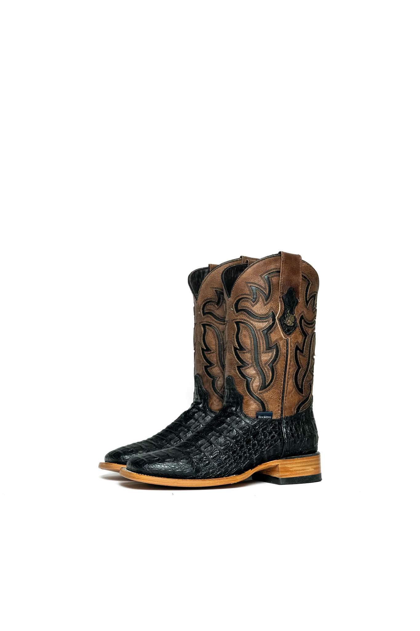 Black Cody Caiman cowboy boots in genuine leather, featuring a square toe, brown shaft with black embroidery, caiman print vamp, and rubber heel.
