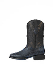 Side of the Python Exotic Cowboy Boots in Blue/Black. Made from genuine leather, blue and black python-print vamp, square toe, and an embroidered shaft. Finished with a durable rubber heel and a blue sole.