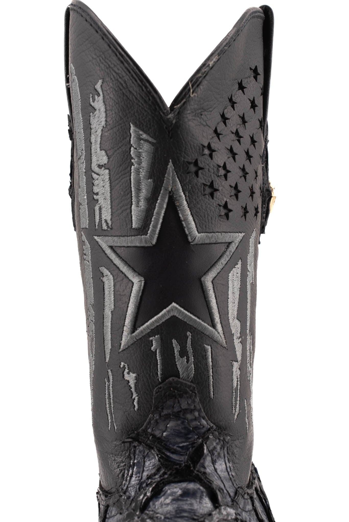 Closer view of the front shaft in smooth black leather, featuring a patchwork design with a star and star-shaped perforations.