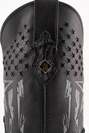 Closer view of the side shaft in smooth black leather, featuring a patchwork design with a star, star-shaped perforations, and a small metallic Rock'em bull's head on the pull strap.